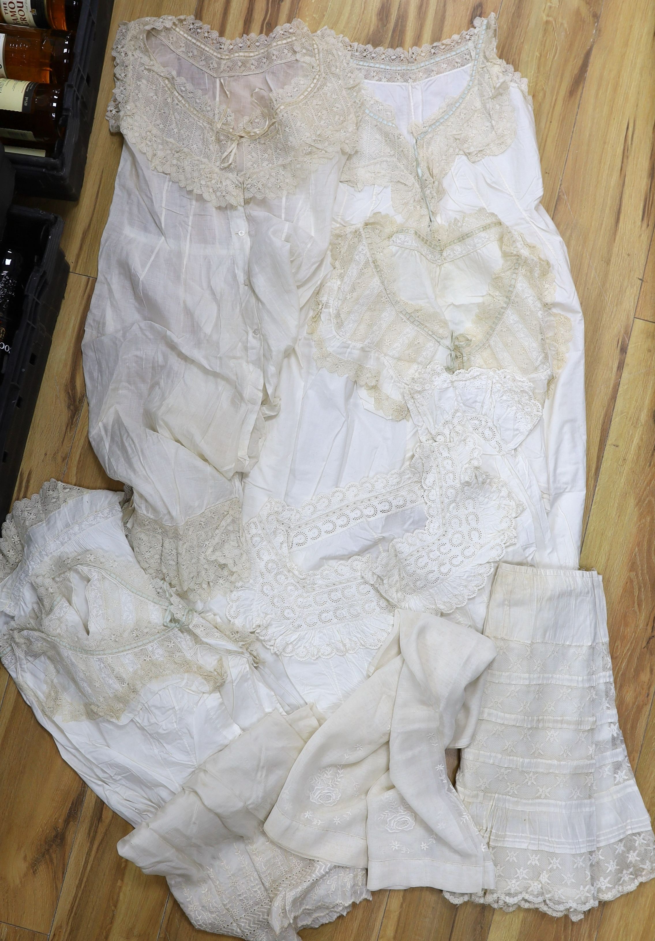 A collection of chemise/pantaloon lace inserted undergarments and a collection of petticoat flounces